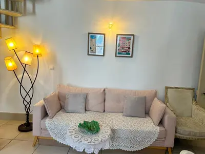 a living room with a couch and a table at Appartement T3 centre ville in Narbonne
