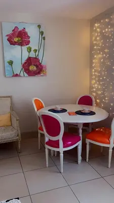 a dining room with a table and chairs at Appartement T3 centre ville in Narbonne