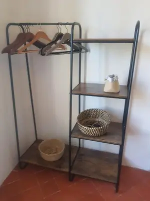 a shelf with shoes and a basket on it at Grande Maison Vigneronne, proche de la mer in Salles-d'Aude