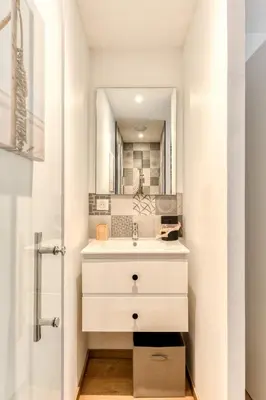 a bathroom with a sink and a shower at La Remise des Amis - Proche du centre du village in Peyriac-de-Mer