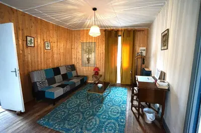 a bedroom with a bed and a window at La maison du Thoré in Saint-Amans-Valtoret