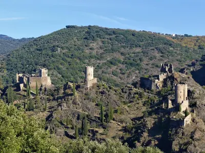 an old castle on top of a mountain at Au soleil couchant in Villemoustaussou