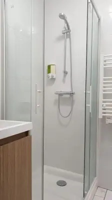 a bathroom with a shower with a glass door at Escapade détente au cœur de Pamiers in Pamiers