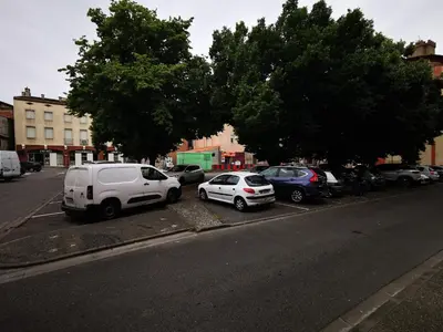 a group of cars parked on the side of a street at Escapade détente au cœur de Pamiers in Pamiers
