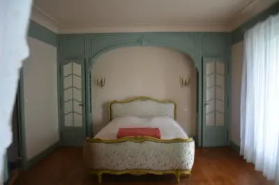 a bedroom with a bed in a room at le lorrain in Saint-Pons