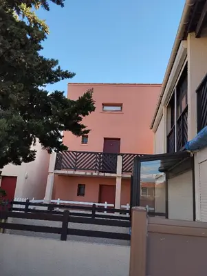 a view of a building from the outside of a building at T2 plage place parking in Port-la-Nouvelle