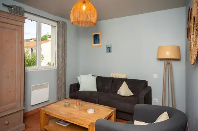 a living room with a couch and a table at Gîte Les Mathouans in Latour-de-France