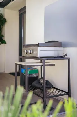 a table with a printer on top of it at 36 2 l air marin Penthouse Netflix Clim Free park Navette Grands Buffets Accès direct autoroute et plages in Narbonne
