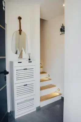 a bathroom with a white dresser and a mirror at 36 2 l air marin Penthouse Netflix Clim Free park Navette Grands Buffets Accès direct autoroute et plages in Narbonne