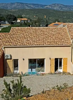 a house with a view of a mountain at Maison confortable à 10 km des plages de la Méditerranée au bord du village pittoresque in Treilles