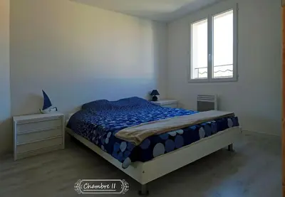 a bedroom with a bed and a window at Maison confortable à 10 km des plages de la Méditerranée au bord du village pittoresque in Treilles