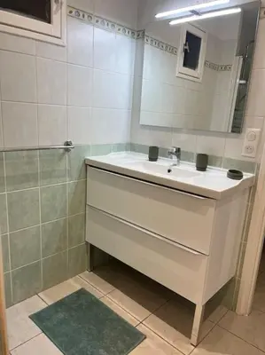 a bathroom with a sink and a mirror at La cave à Papé in Peyriac-de-Mer