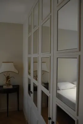a bedroom with a sliding glass door with a bed at TEMPS de PAUSE - CAMPAGNE in Lautrec