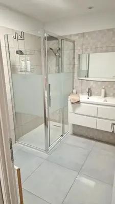 a bathroom with a shower and a sink at L’Oliveraie in Narbonne