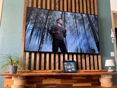 a man standing in front of a picture of trees at Confort sur le port in Gruissan