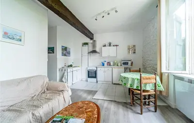 a living room with a couch and a table at 1 Bedroom Stunning Home In Chalabre in Chalabre