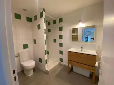 a bedroom with a bed and a large window at T4 bord canal du midi, piscine in Homps