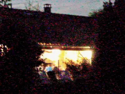 a building with a lit up window at night at Domaine du Bourdil au pays Cathare in Chalabre