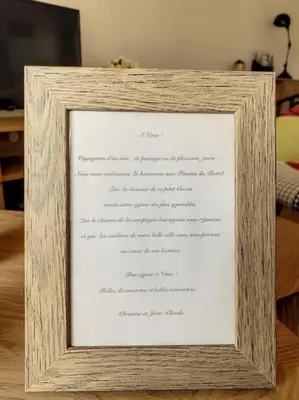 a picture of a document in a wooden frame at Les pénates du pastel - Jardin & Terrasse in Villefranche-de-Lauragais