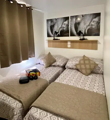 a bedroom with two beds at Domaine de la Palme in Lapalme