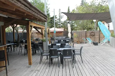 a group of tables and chairs on a patio at Domaine de la Palme in Lapalme