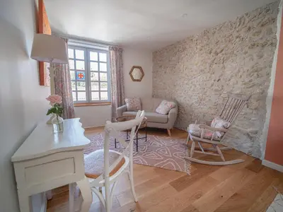 a living room with a couch and chairs and a table at Clos des Oliviers in Mirepoix