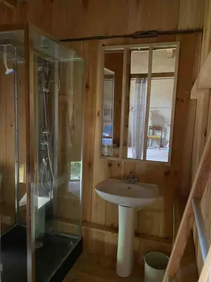 a bathroom with a sink and a shower at Souplassens in Rieumajou
