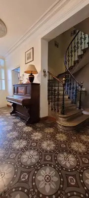 a room with a staircase and a piano in a house at Comme à la Maison - Accueil tout Public - Groupes - Rando - Vélos - Motos in Saint-Paul-de-Fenouillet
