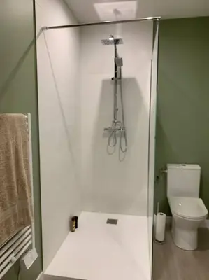 a bathroom with a glass shower with a toilet at Appartement cœur de village Numéro1 in Peyriac-de-Mer