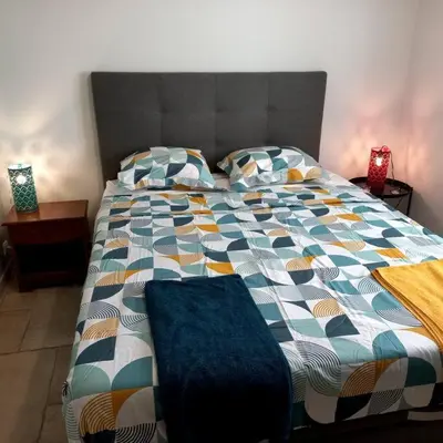 a room with a bunch of pillows on a rug at Appartement avec accès privé à la rivière in Ladern-sur-Lauquet