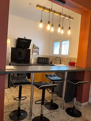 a red and black appliance sitting on a counter at Loccitan in Capestang