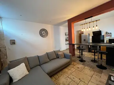 a living room with a couch and a table at Loccitan in Capestang