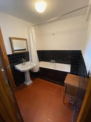 a bathroom with a sink and a bath tub and a sink at Os-thel, Chambres à louer in Tautavel