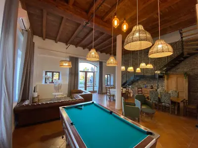 a living room with a pool table at Maison, canal du midi piscine in Homps