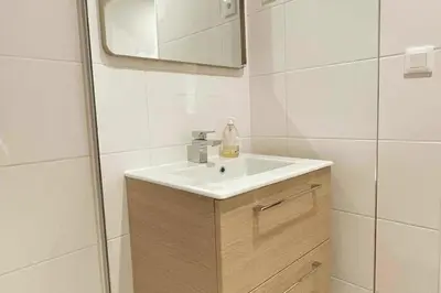 a bathroom with a sink and a mirror at Cozy & Elegant Appartement Narbonne in Narbonne