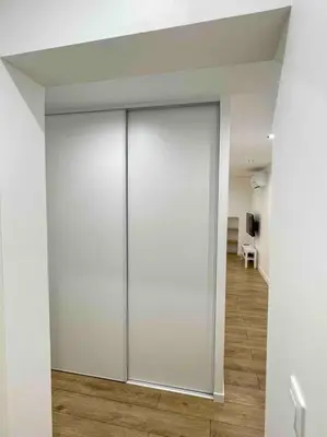a room with white sliding doors in a room at Cozy & Elegant Appartement Narbonne in Narbonne