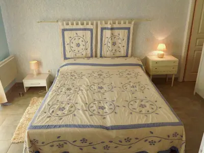 a bedroom with a bed and two night stands at Serene Villa Stay near Narbonne in Narbonne