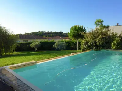 a large swimming pool in a yard with a yard at Serene Villa Stay near Narbonne in Narbonne