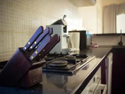 a knife block sitting on top of a stove in a kitchen at Serene Villa Stay near Narbonne in Narbonne