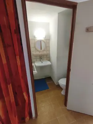 a bathroom with a tub and a toilet and a sink at APPARTEMENT DE VACANCES A LA MER DANS RESIDENCE SECURISEE in Gruissan