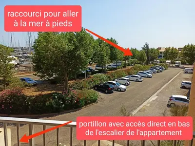 a row of cars parked in a parking lot at APPARTEMENT DE VACANCES A LA MER DANS RESIDENCE SECURISEE in Gruissan
