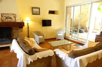 a living room with two couches and a fireplace at GîTE-FAMILLE NOMBREUSE-SÉMINAIRE-PATIO in Ornaisons