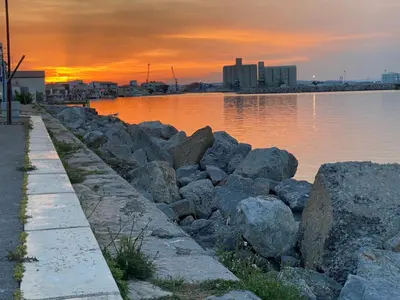 a group of rocks next to a body of water at Le studio du Port in Port-la-Nouvelle