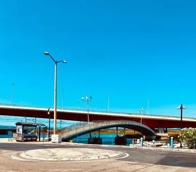 a bridge over a river with a road at Le studio du Port in Port-la-Nouvelle