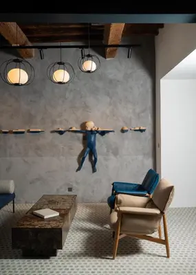 a painting of a man jumping in the air in a living room at Bouquerie Lagrasse in Lagrasse