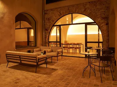 a living room with a couch and chairs and a table at Bouquerie Lagrasse in Lagrasse