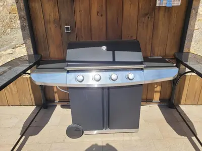 a barbecue grill sitting on top of a table at Loft Porte Sud 140 m2 in Salles-d'Aude