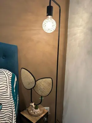 a room with a lamp and a table with a bed at LA MADDYSON in Narbonne
