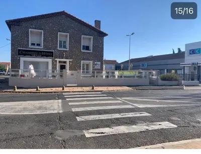 an empty parking lot in front of a building at LA MADDYSON in Narbonne