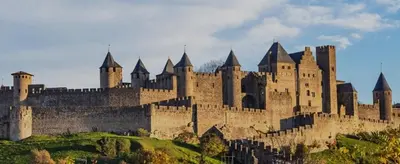 a large castle sitting on top of a hill at Chambre de charme in Cavanac